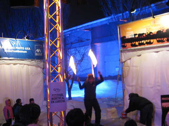 Woman dancing with fire at the Montreal All-Nighter