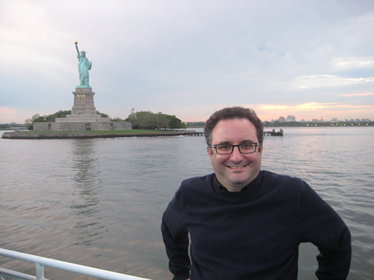 Sam Greenfield in front of the Statue of Liberty